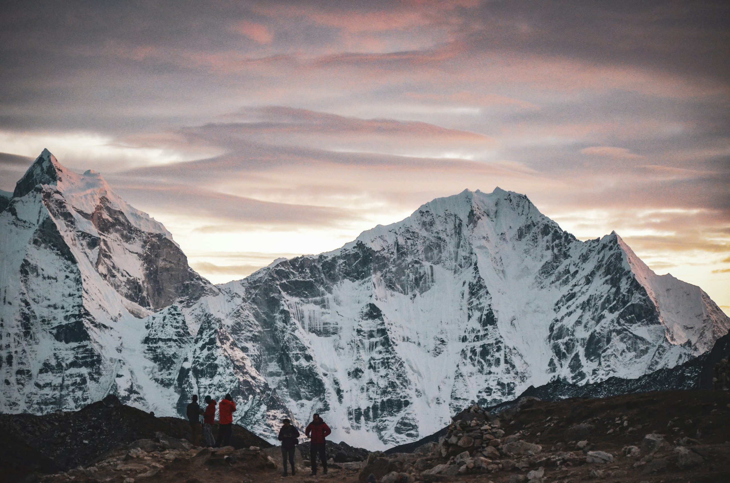 Sunset over the Khumbu peaks with trekkers in the foreground, Nepal