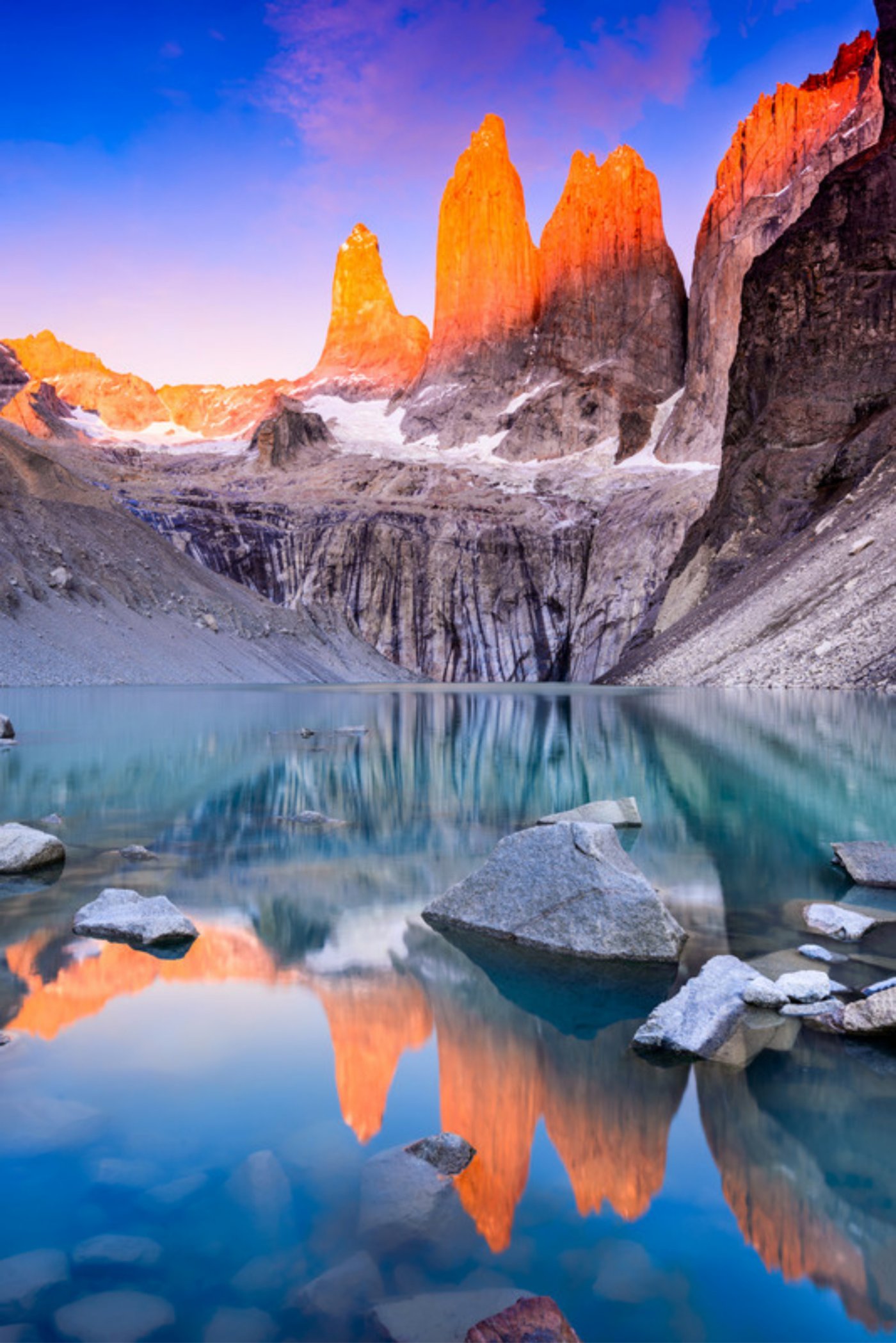 The three towers at sunrise above the Base Torres lake